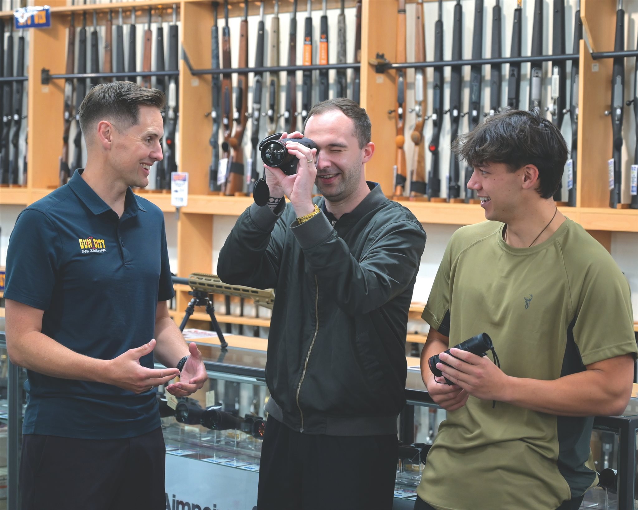 Thermal imaging scope showing heat signatures of animals in darkness