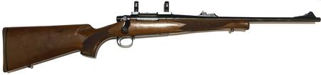 Buy 243 Remington 7 Blued Wood 18" with Rings in NZ. 
